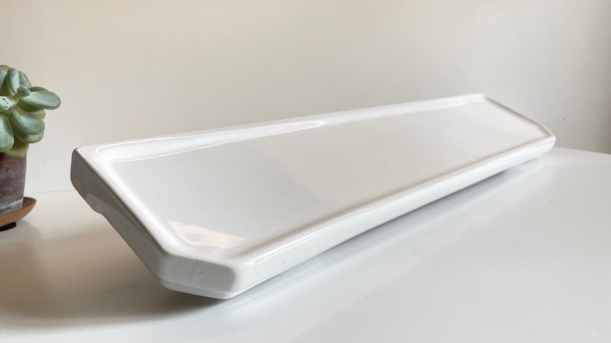 Vintage ceramic wall shelf