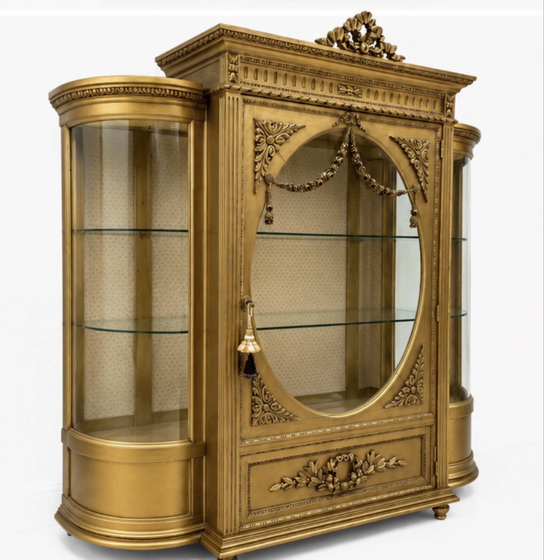 French antique Louis XVI display cabinet in gilded wood with curved glass sides.