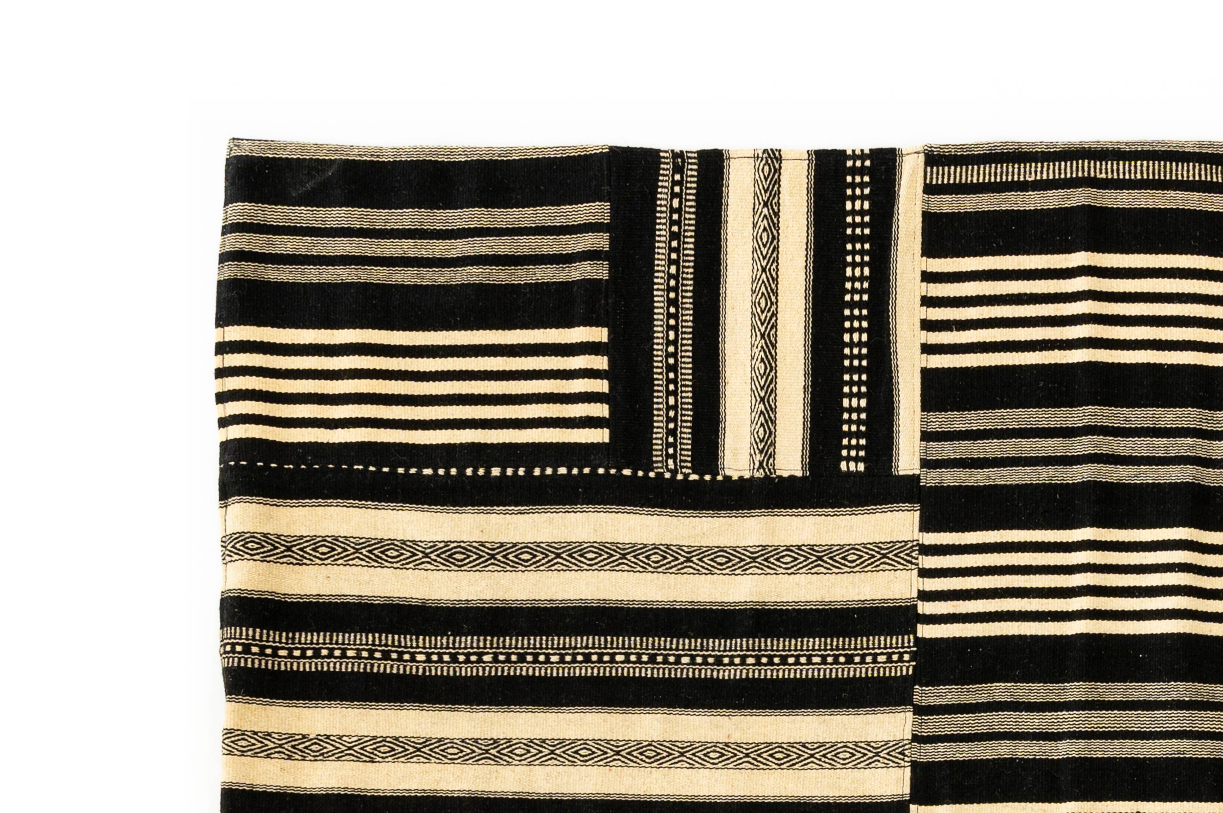 NOS Minimalist patchwork kilim by Axeco Svenska AB. 279 x 199 cm (110 x 78 in)