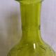 Cut and engraved green blown glass carafe vase
