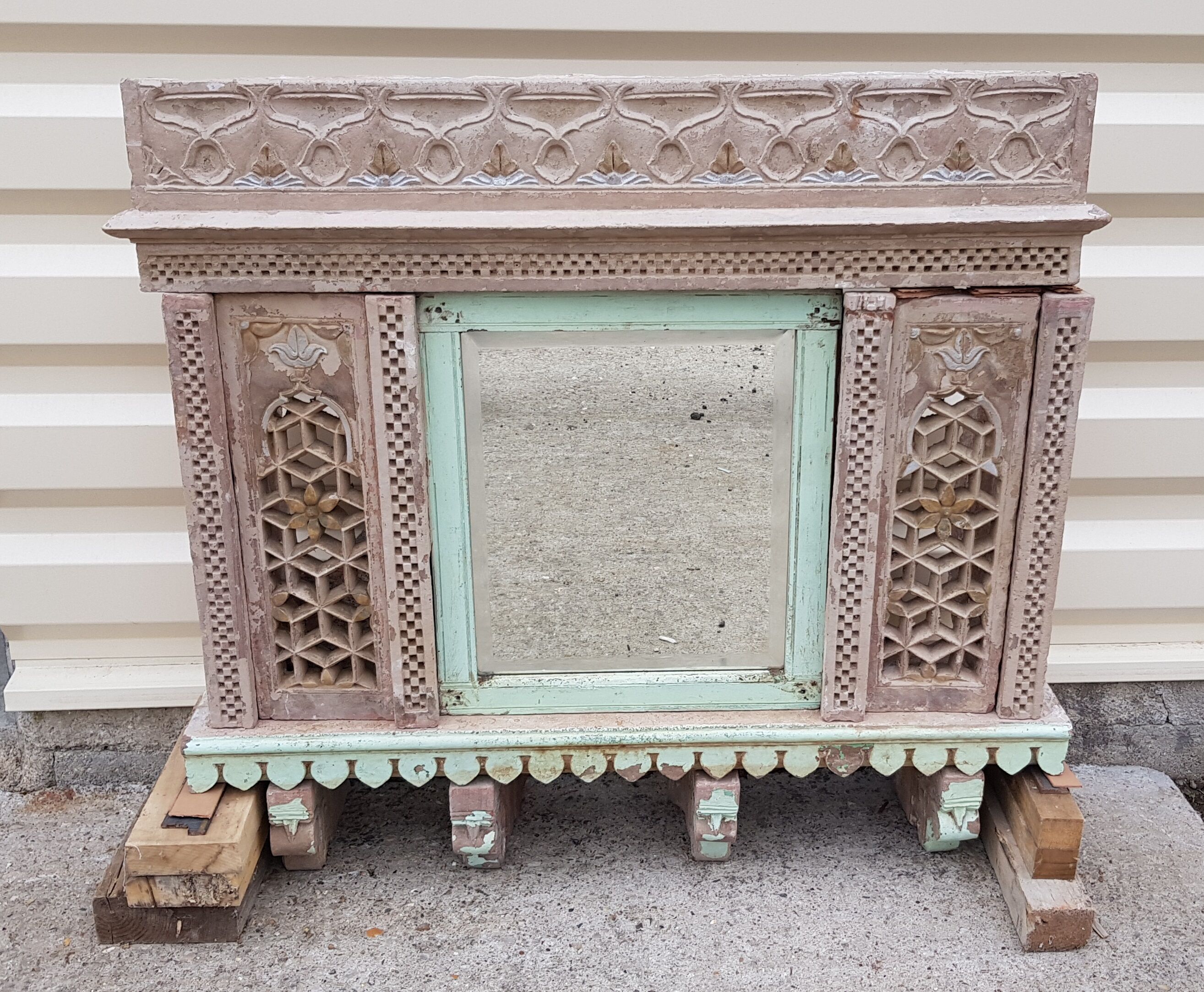 Fully hand-carved stone window with mirror