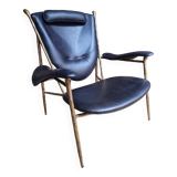 Black and golden bronze designer armchair