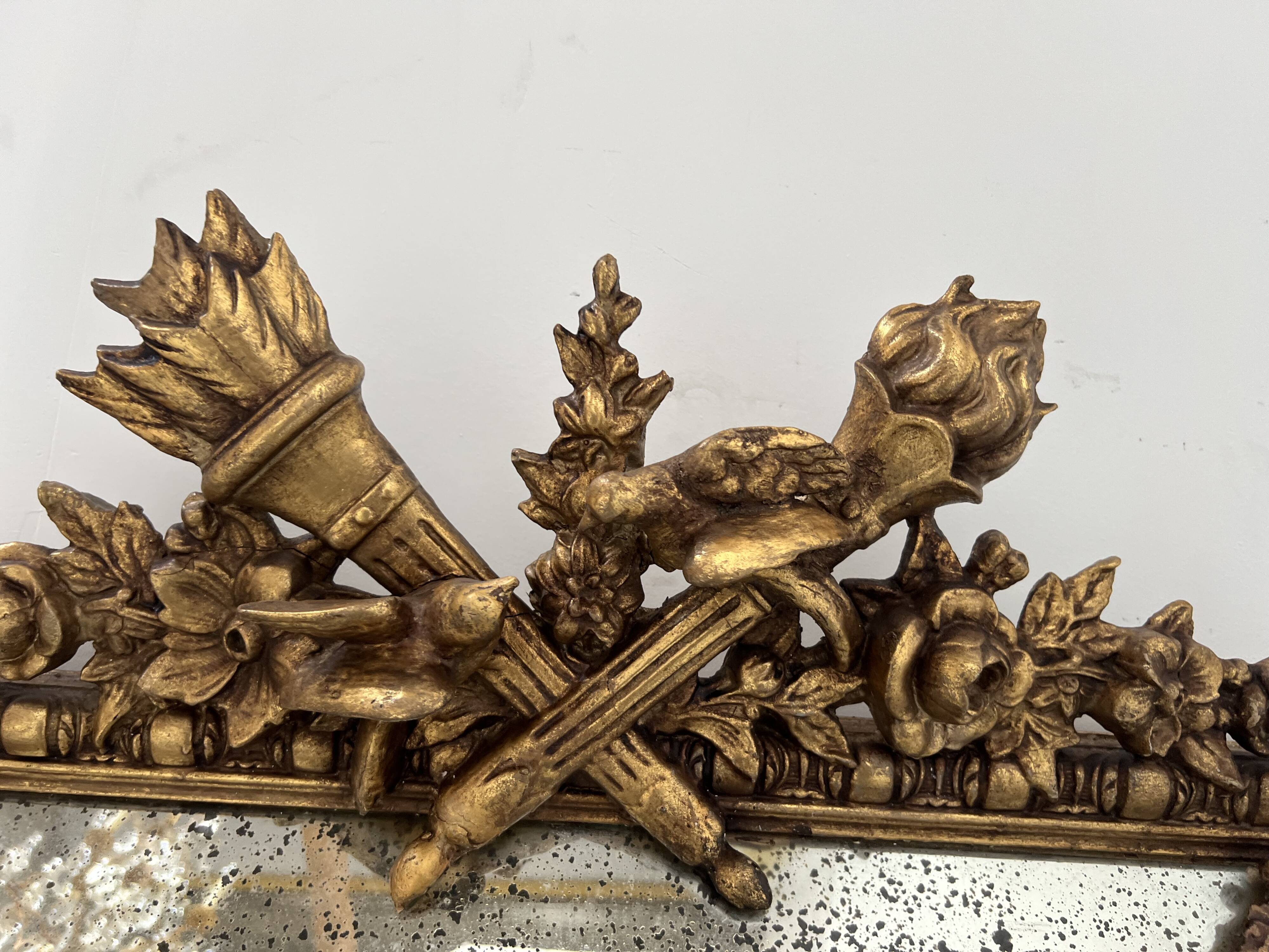 Louis XVI style mirror with parecloses in wood and gilded stucco, 19th century