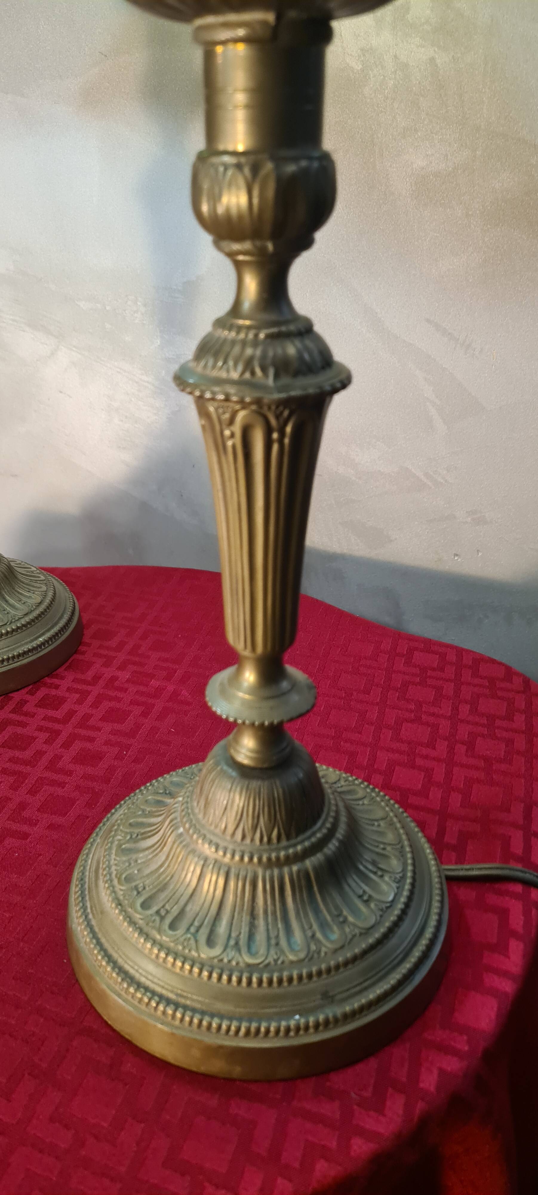 Pair of art nouveau bronze lamps, Tiffany-style glass lampshades