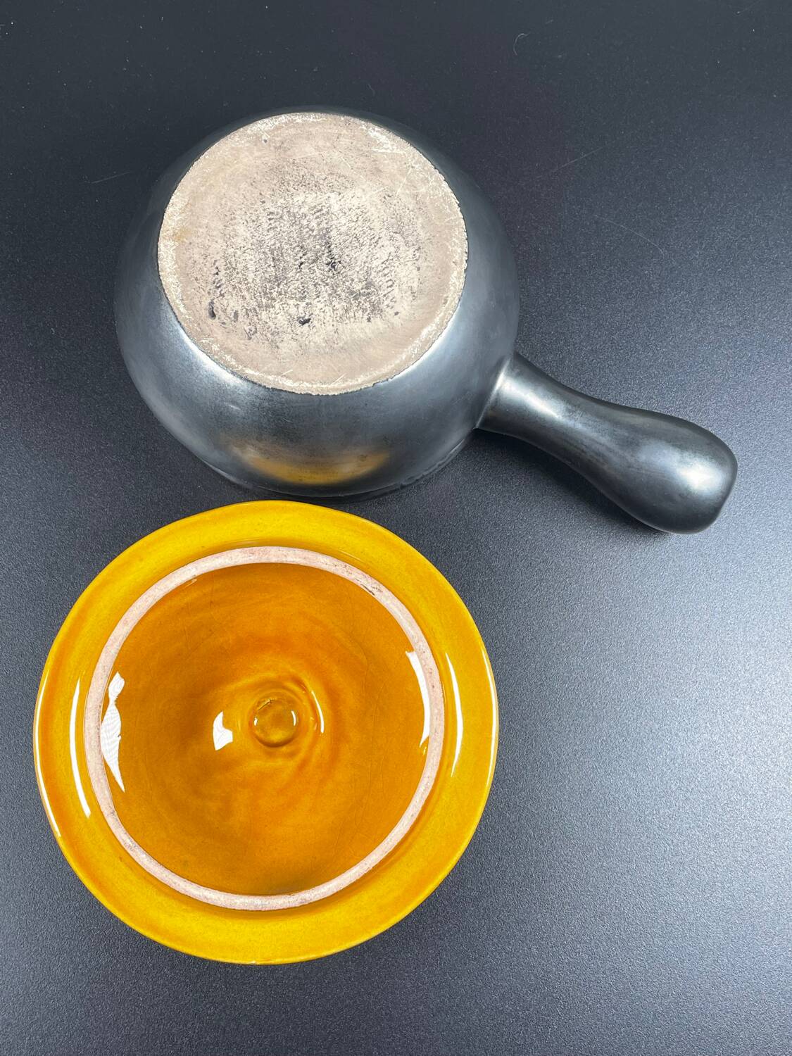 Black and yellow fondue pot