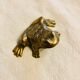 Small brass frog