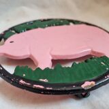 Cast iron underside, pink pig