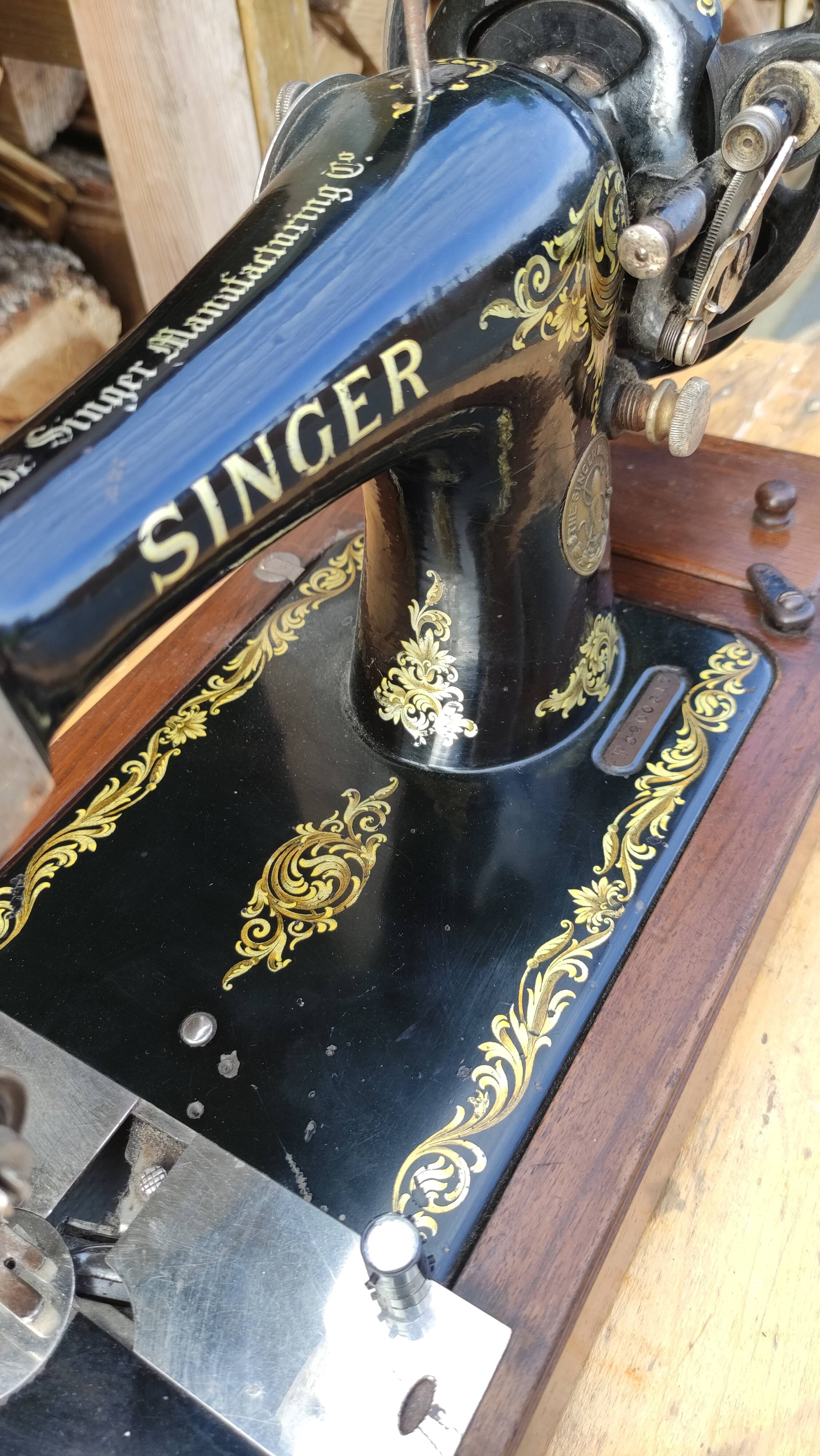 Old Singer sewing machine on its original base