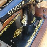 Old Singer sewing machine on its original base