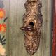Alsatian bonnet maker in painted softwood with floral decorations