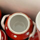 Coffee service, orange earthenware cups from Digoin Sarreguemines.