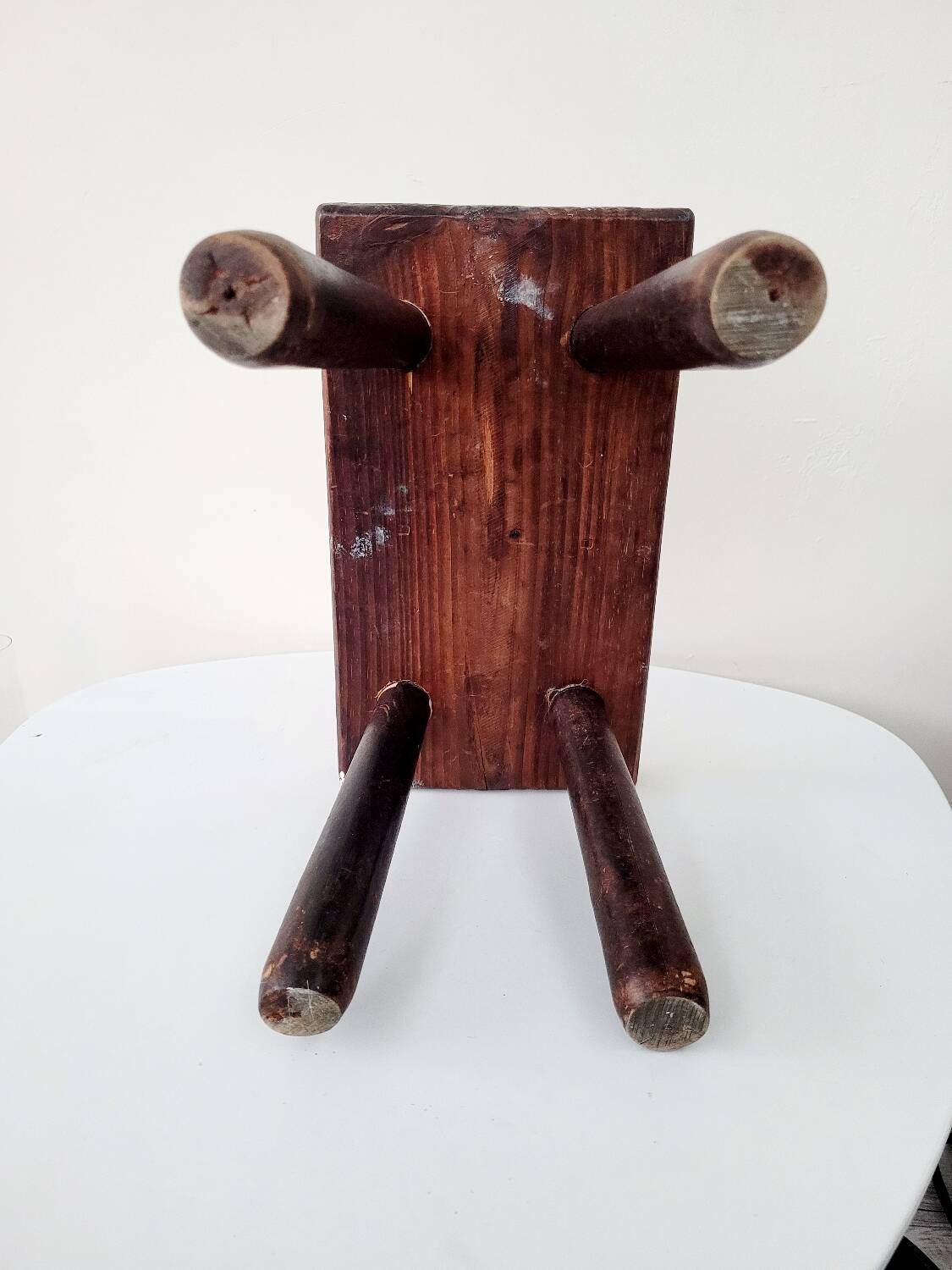 Old small solid wood milking stool