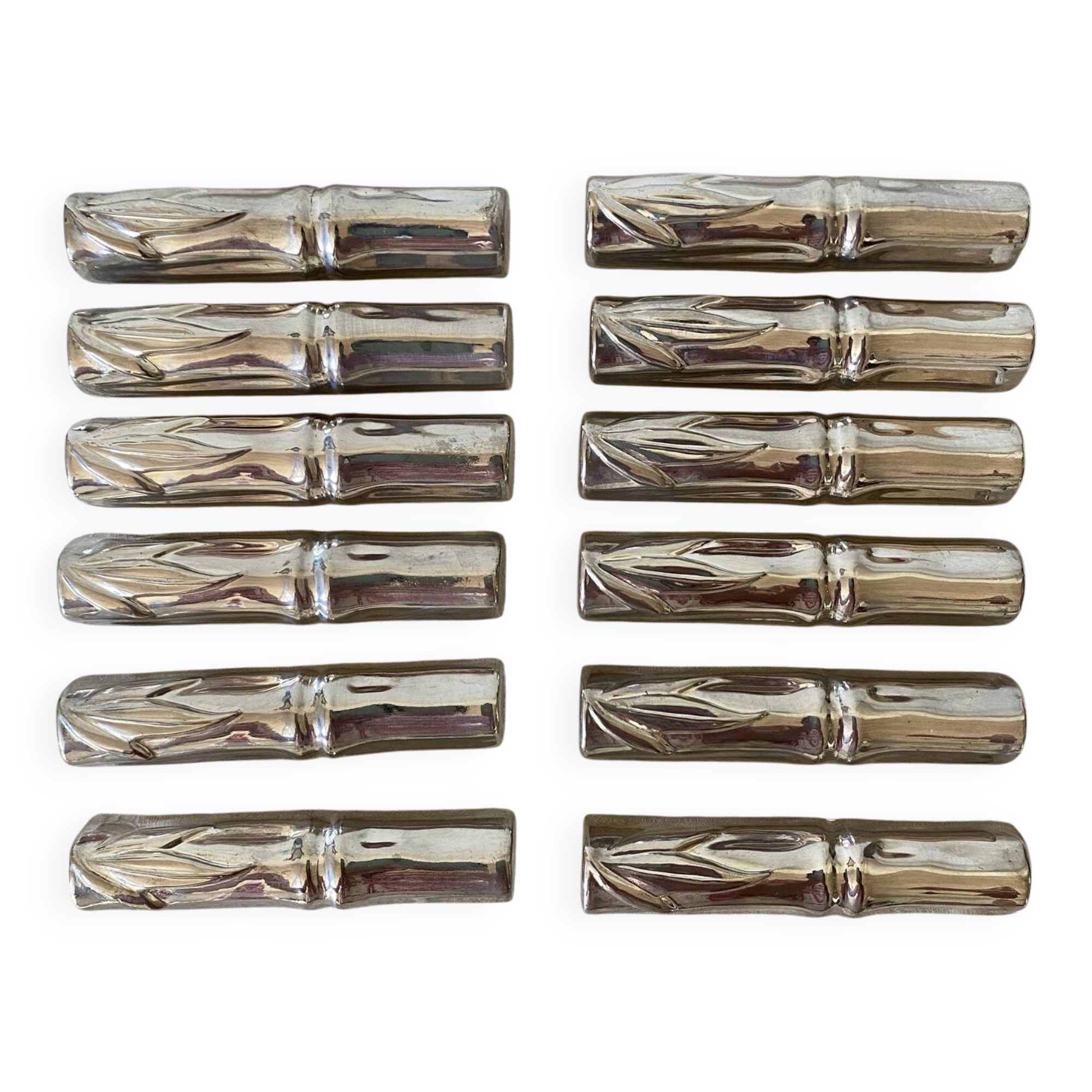Silver bamboo knife rests from the 1980s.