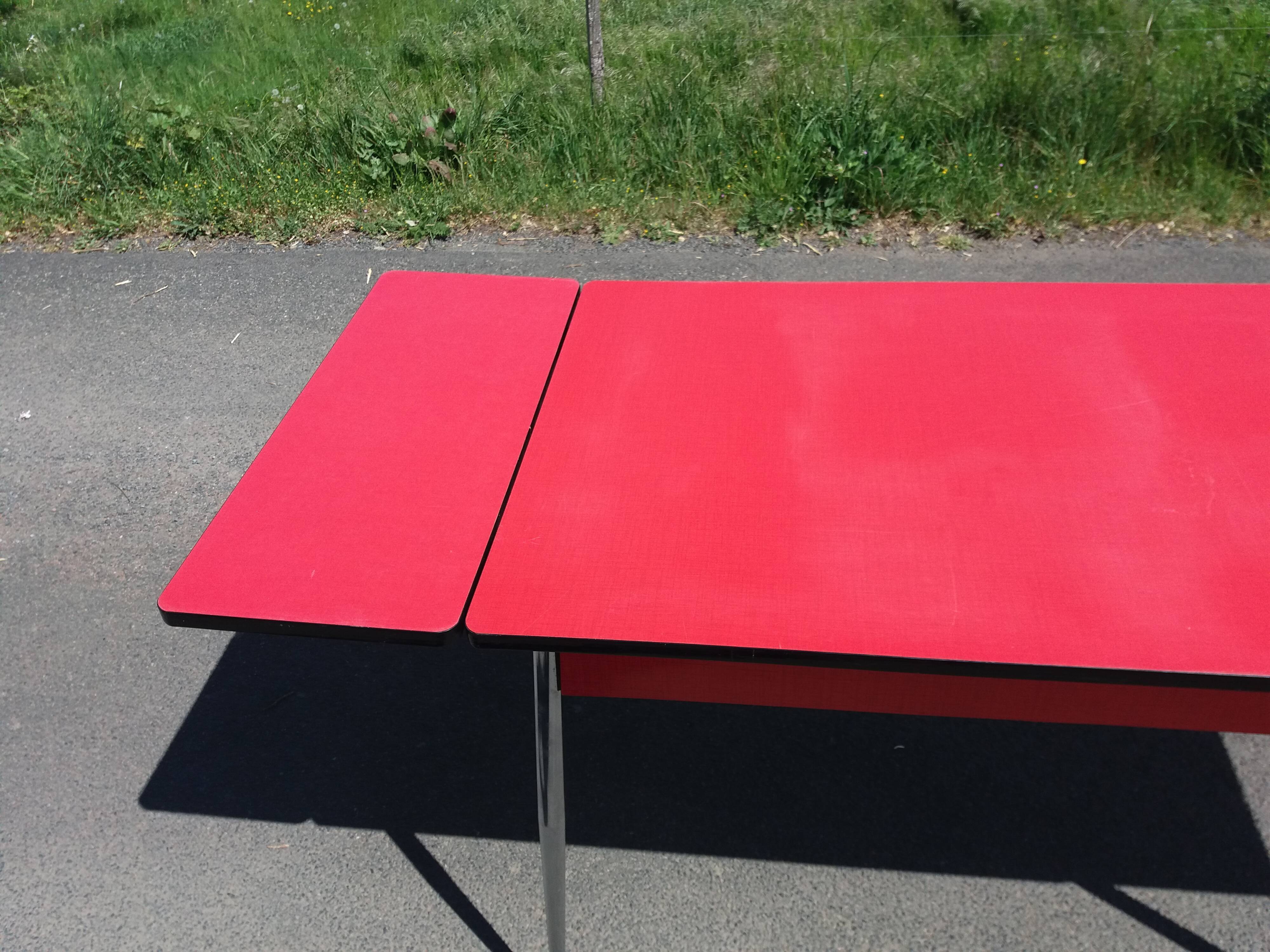 Dining table with red formica extensions