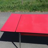 Dining table with red formica extensions