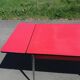 Dining table with red formica extensions