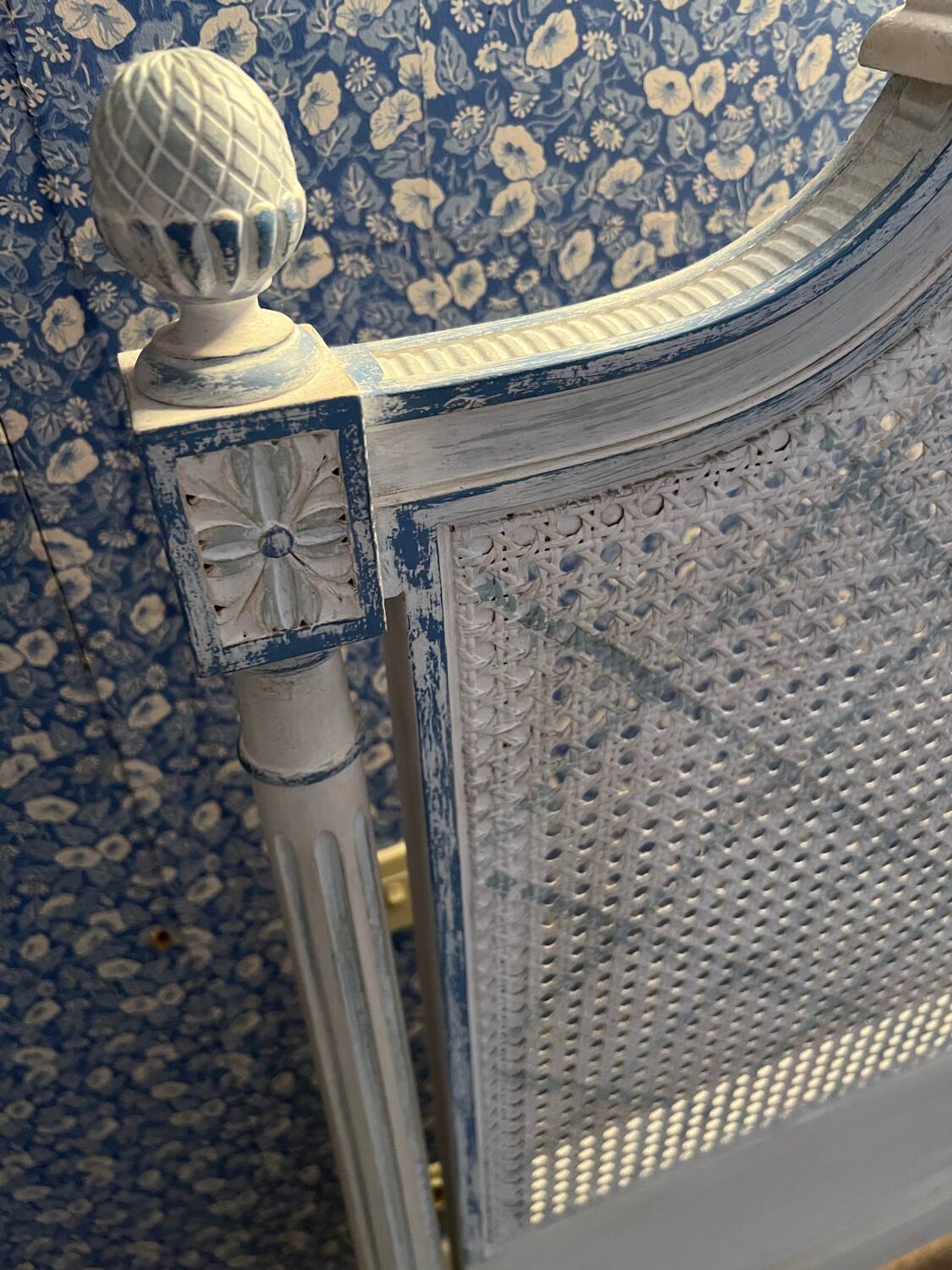 White wooden cane bed