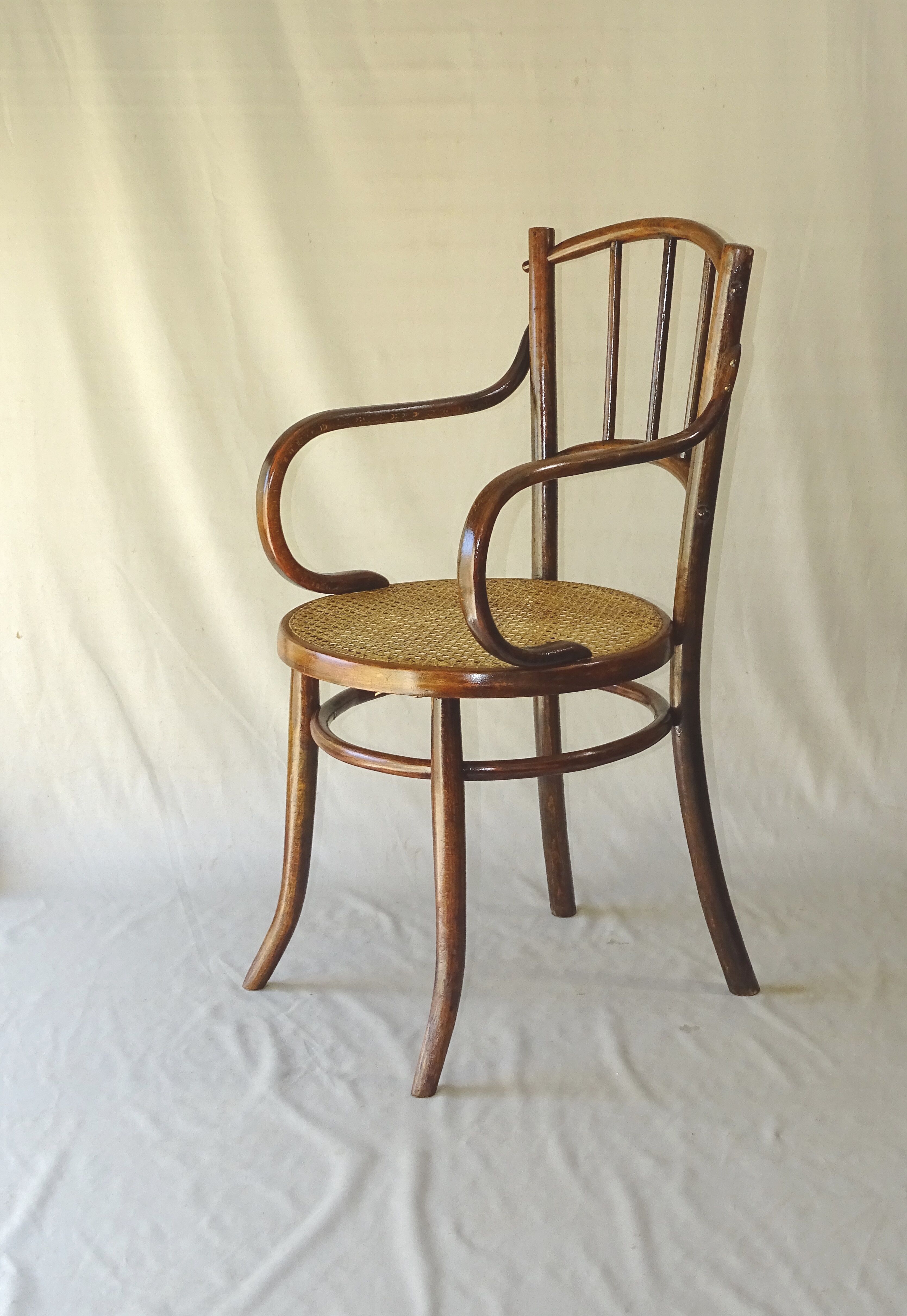Small canned armchair; in curved wood, bistro, 1890
