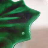 empty green ceramic pocket cup, small chips on the edges, signed