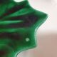 empty green ceramic pocket cup, small chips on the edges, signed