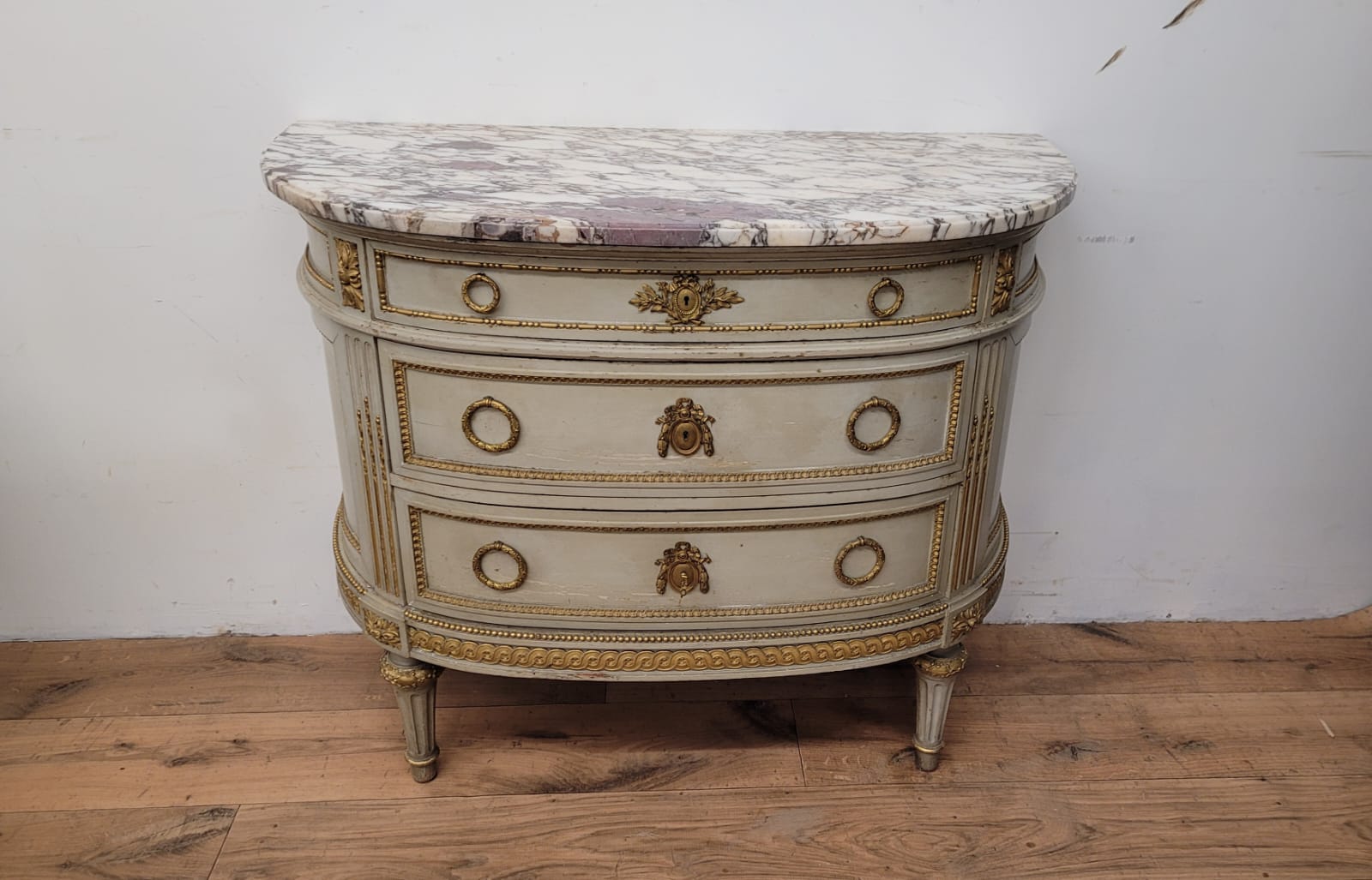 Lacquered half-moon chest of drawers with marble top