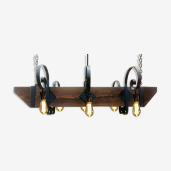 Wrought iron chandelier and wooden beam