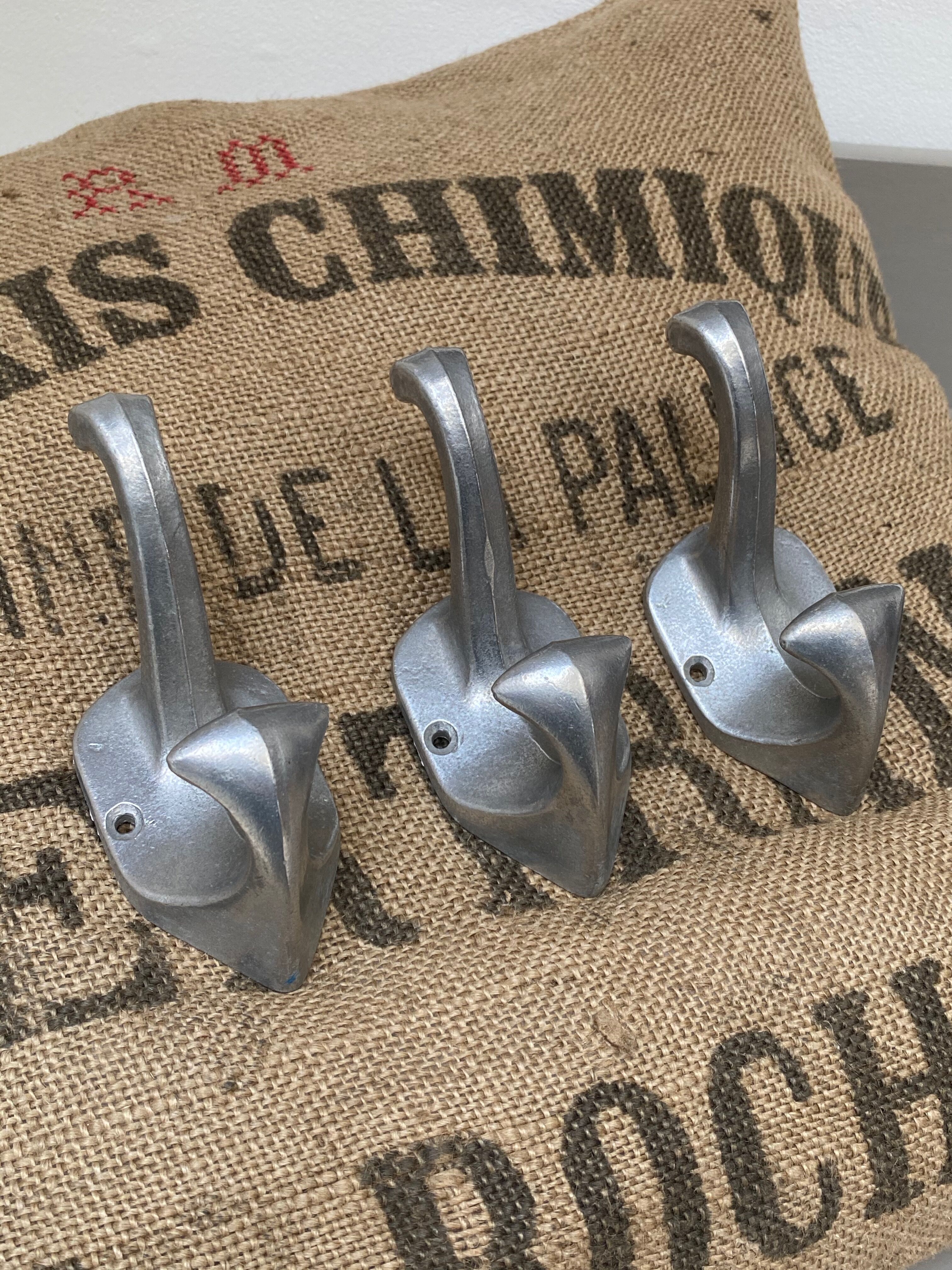 3 cast aluminum hooks