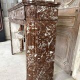 Red marble fireplace in the Louis XVI style, late 19th century
