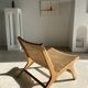 Reclining armchair in natural wood and woven rattan