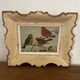 Vintage painting on panel of 3 tits on a branch.