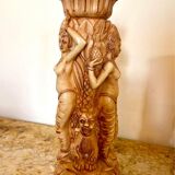 Two ancient Indonesian candlesticks.