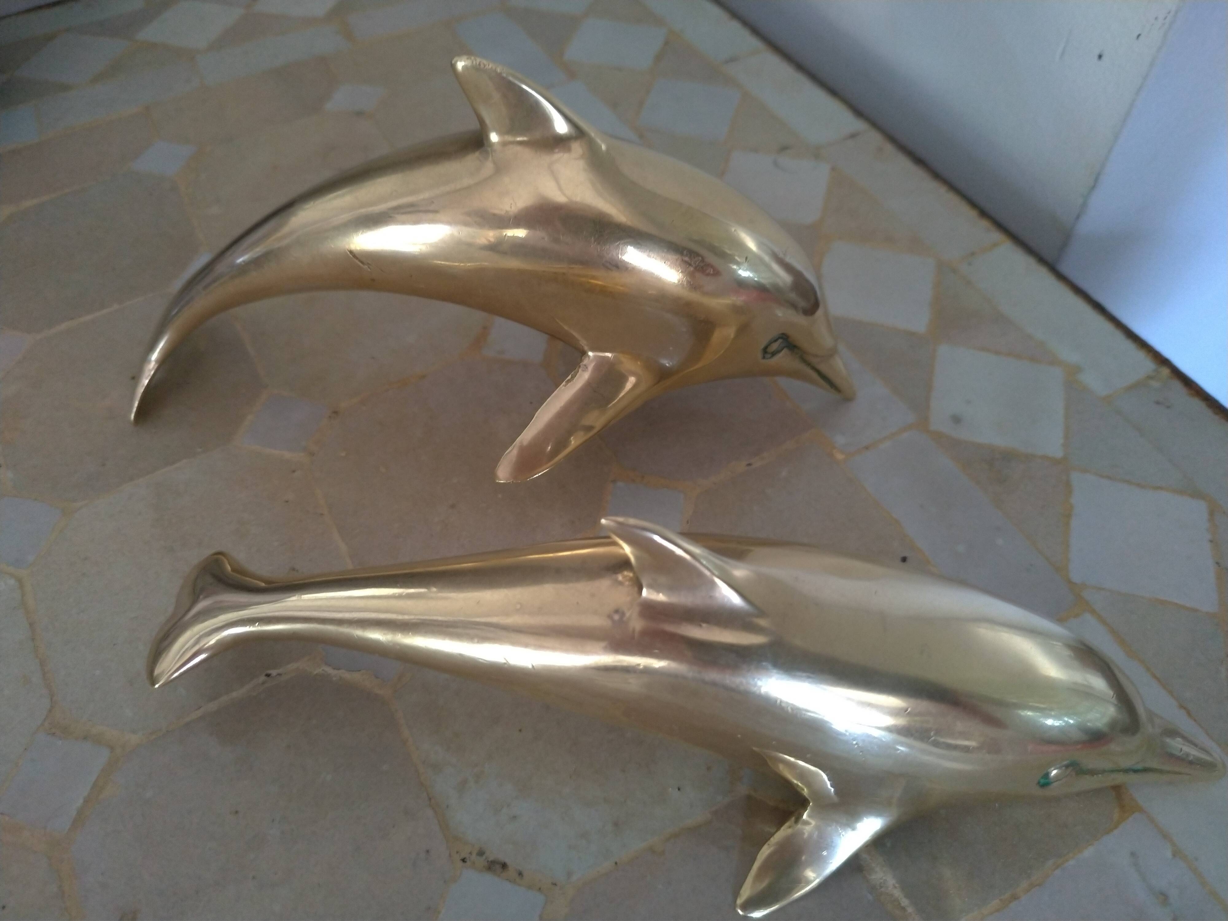 Brass dolphins