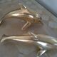 Brass dolphins