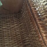Bagged suitcase in braided wicker and wood