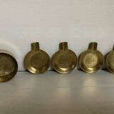 Quatre cendriers individuels en laiton