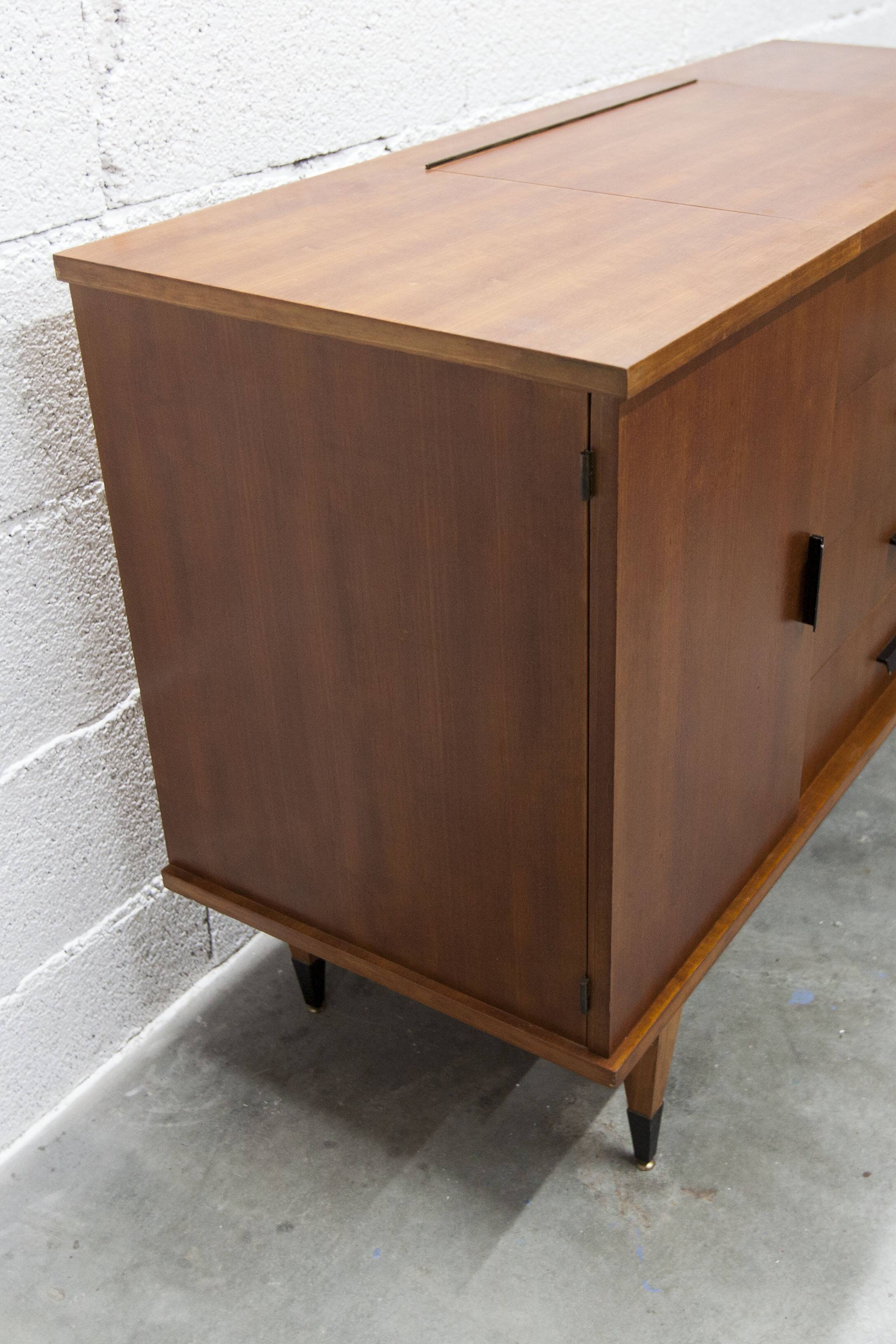 1960s teak sideboard with 4 drawers, 2 doors, and a mirror.