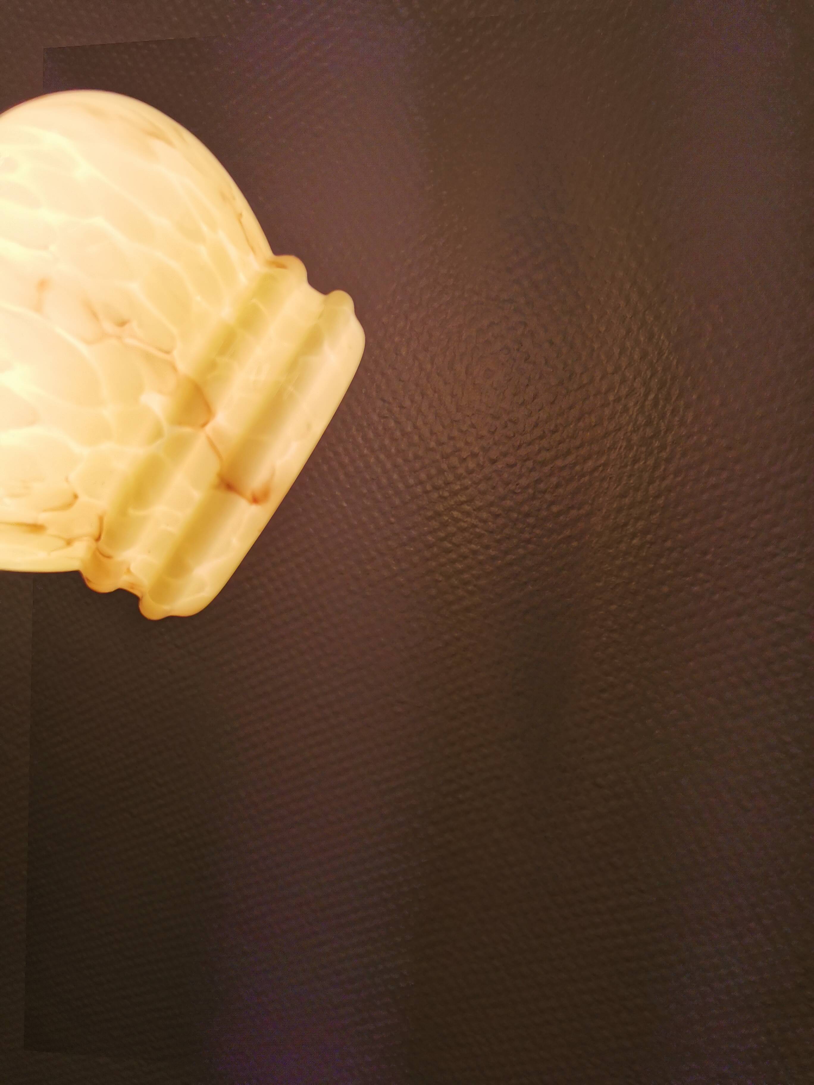 Small Art Deco hanging lamp in cream colored glass with bakelite top. Estimated 1950s