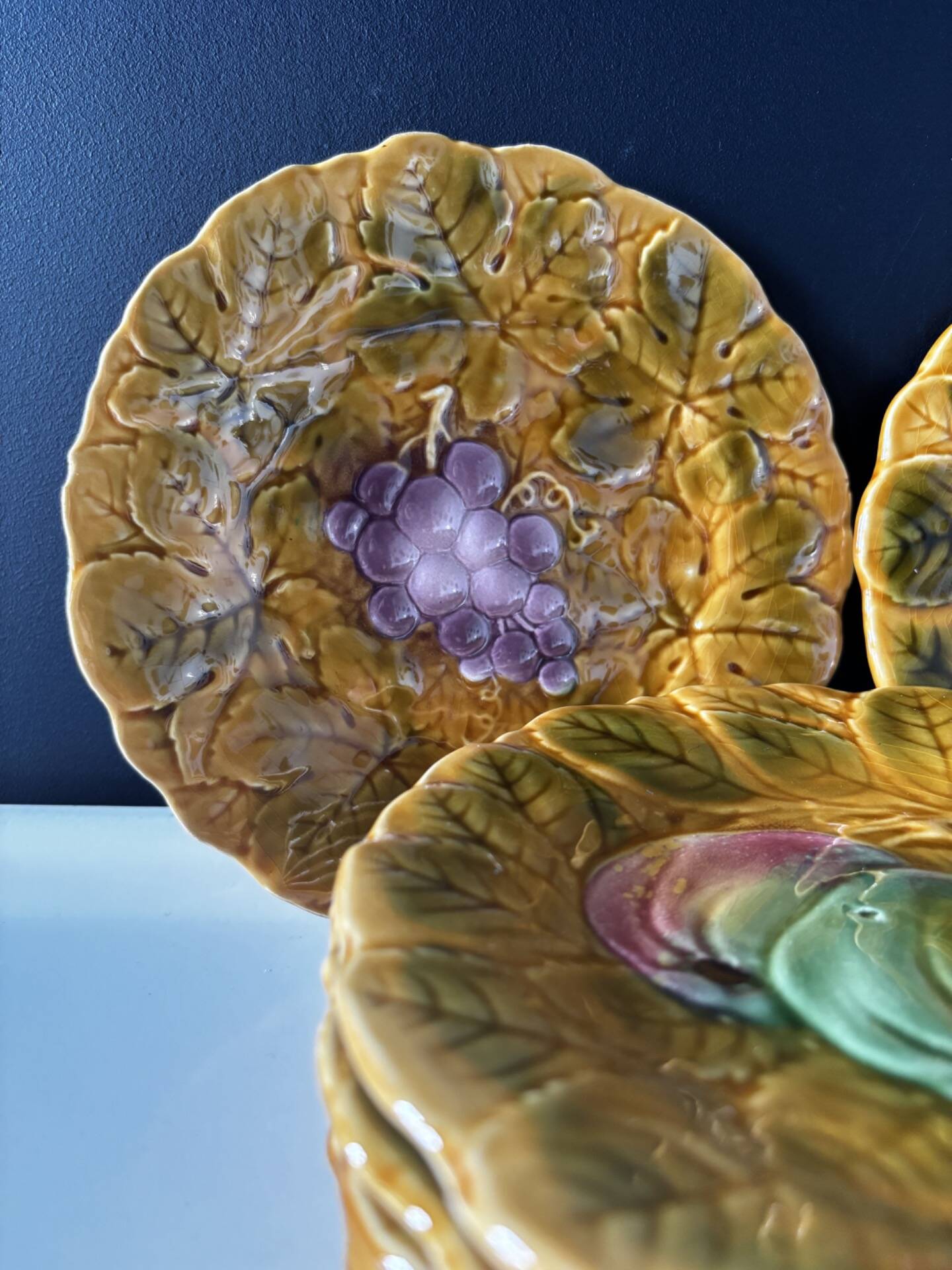 Set of 8 Sarreguemines barbotine plates — relief fruit decoration