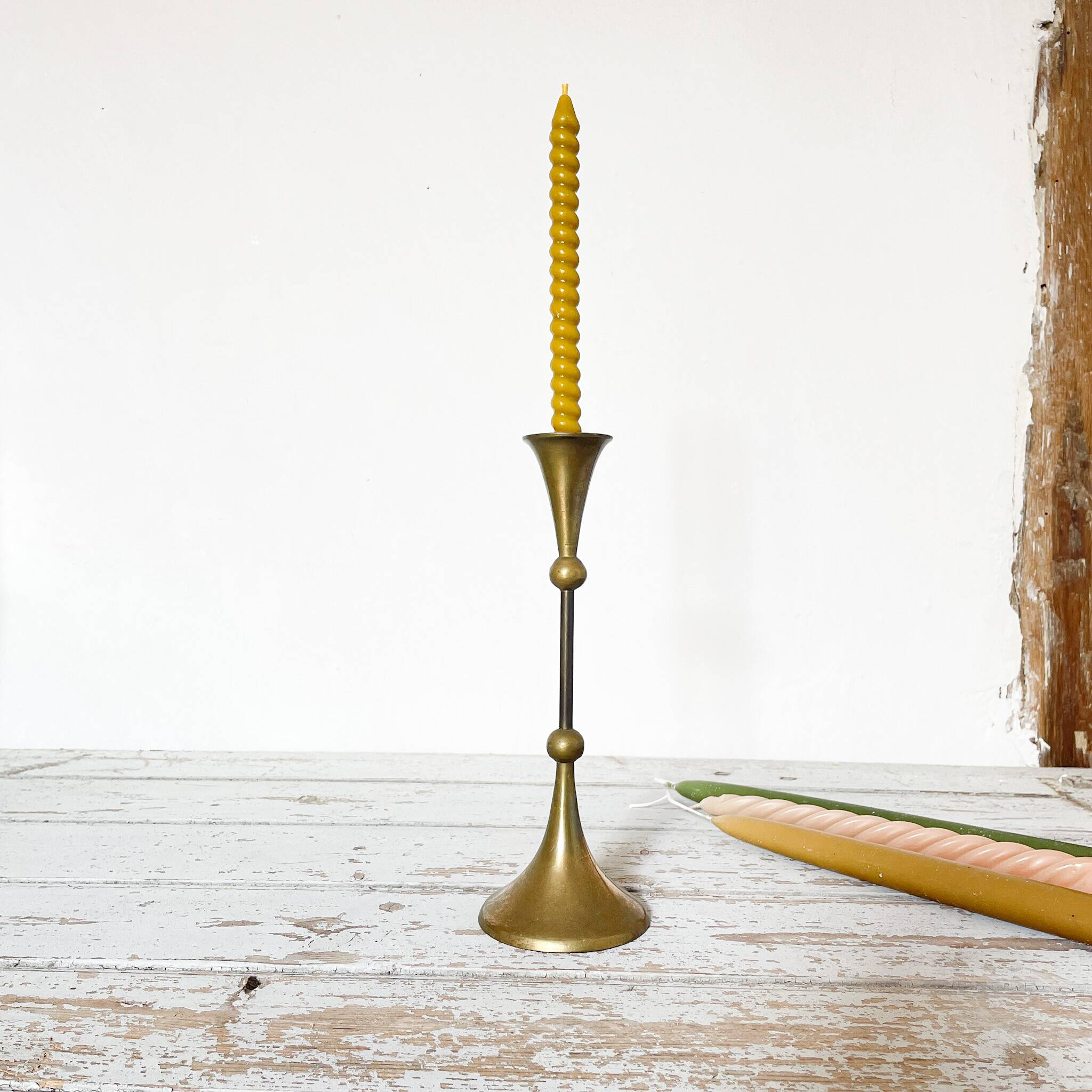 Tapered brass candle holder