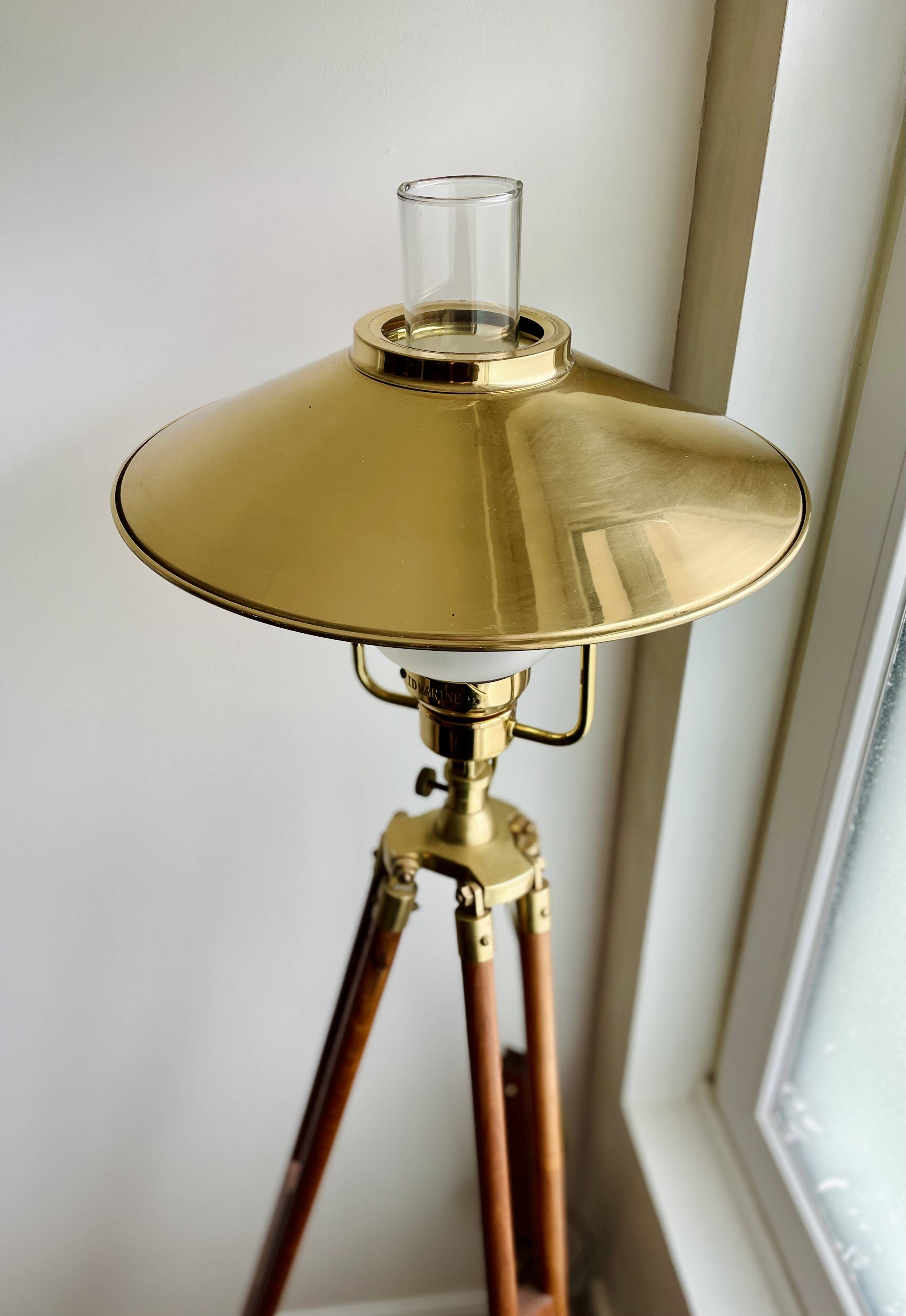 Vintage wooden and brass tripod lamp in marine style.