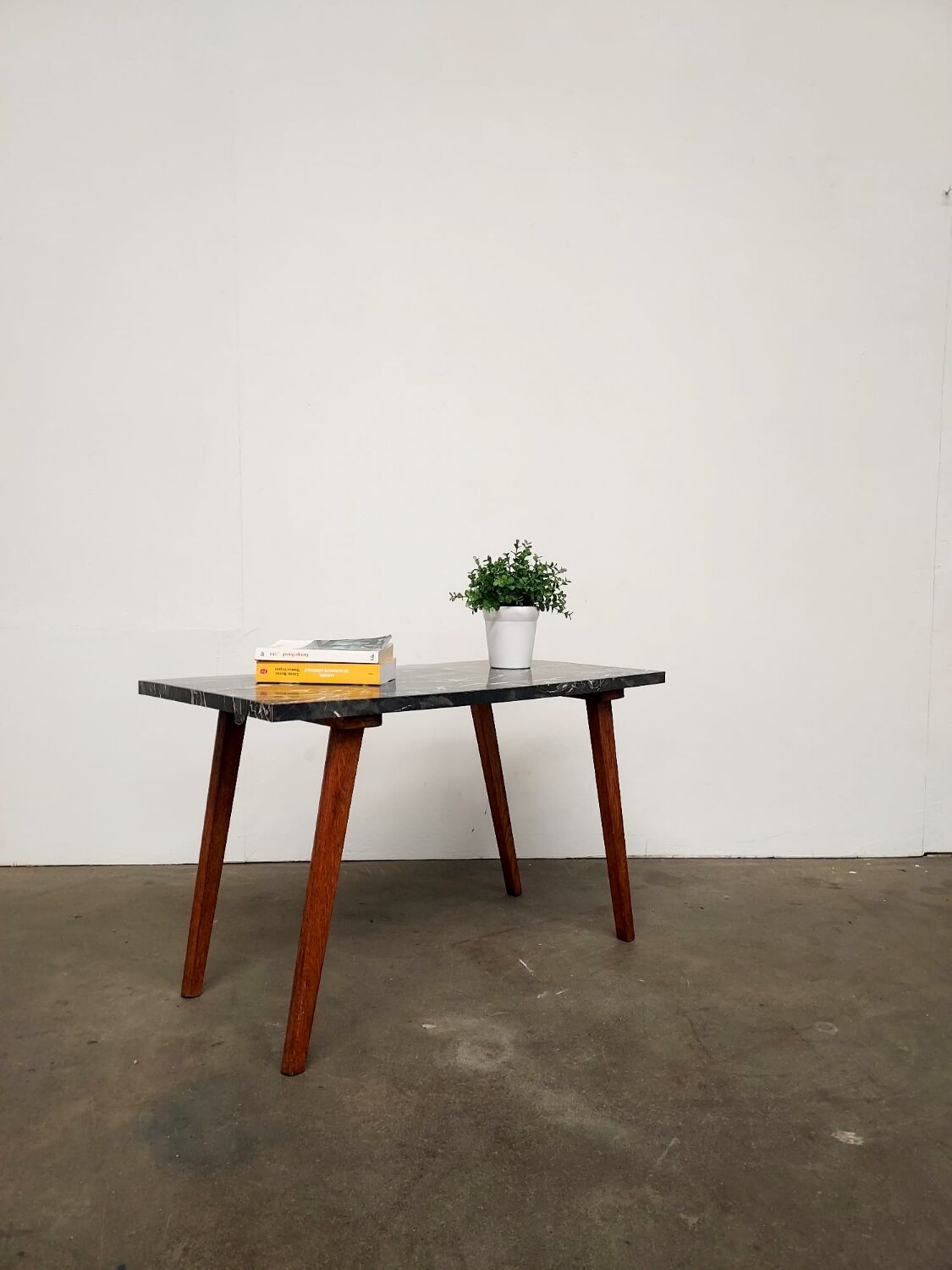 Marble effect Formica coffee table - flared legs