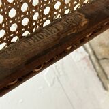 Thonet rocking chair in curved wood and cane from the 1900s