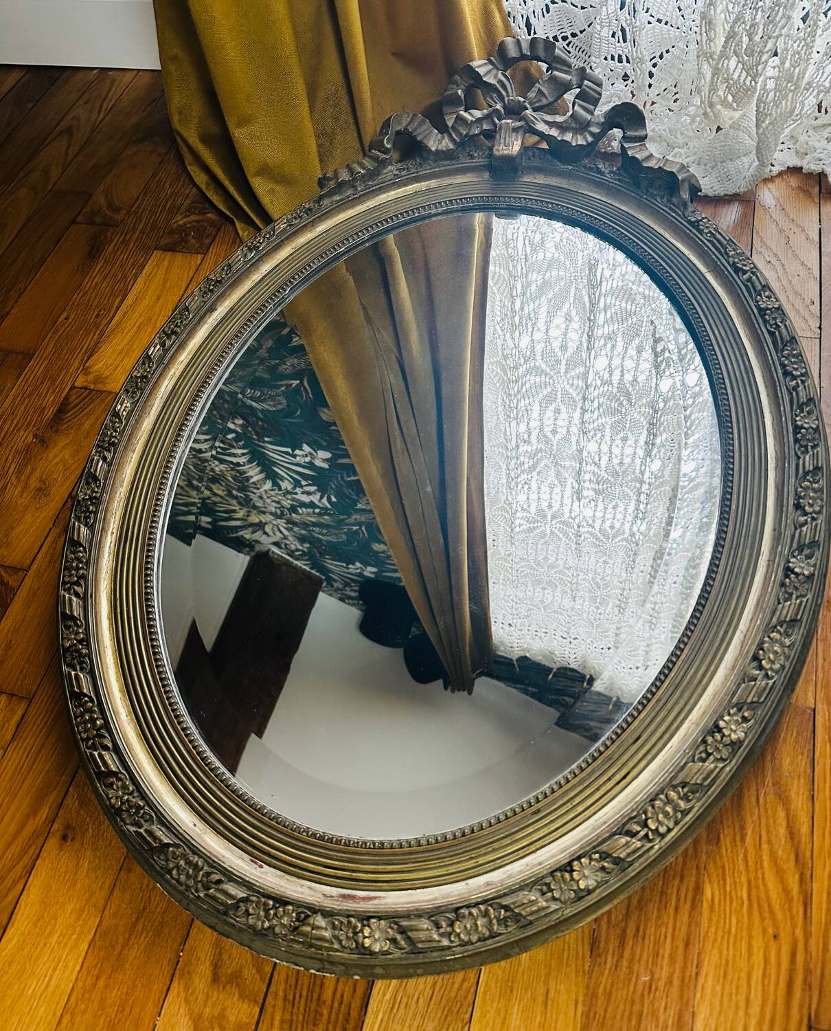 Large antique oval mirror