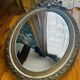 Large antique oval mirror