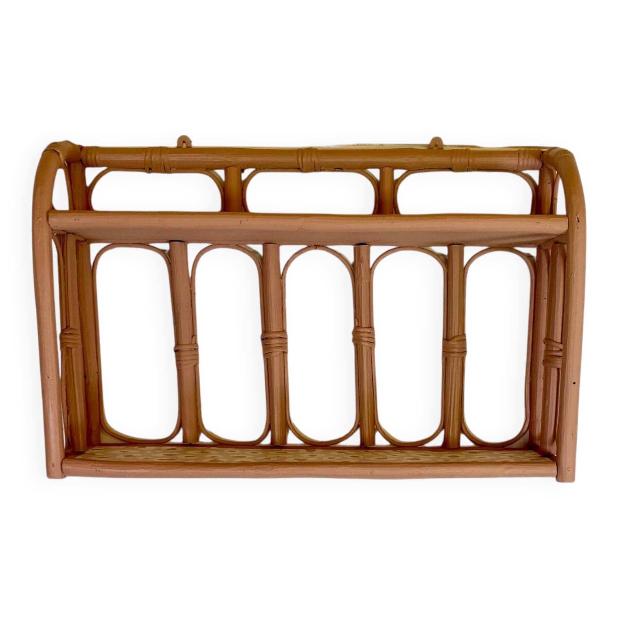 Pale pink rattan wall shelf