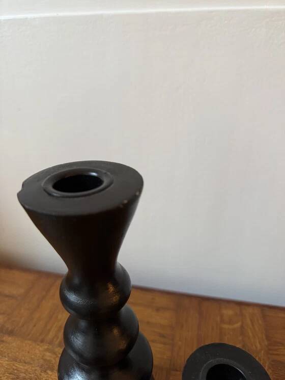 Pair of black turned wood candlesticks