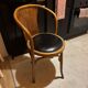 Wooden chair with black leather seat