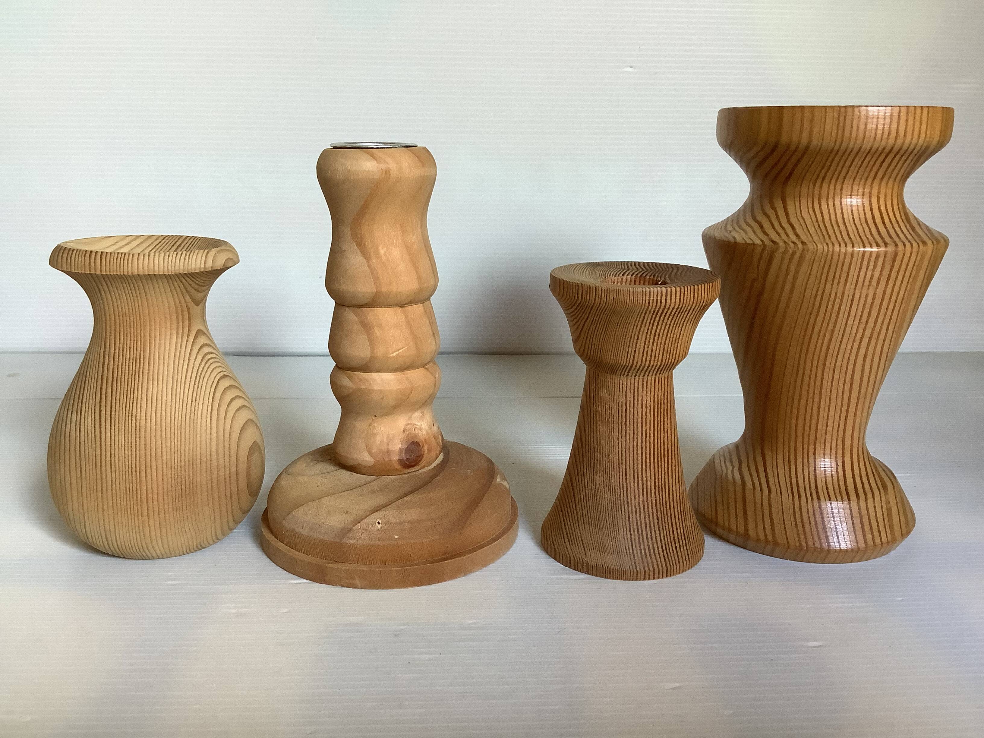 Four wooden vases and candlesticks