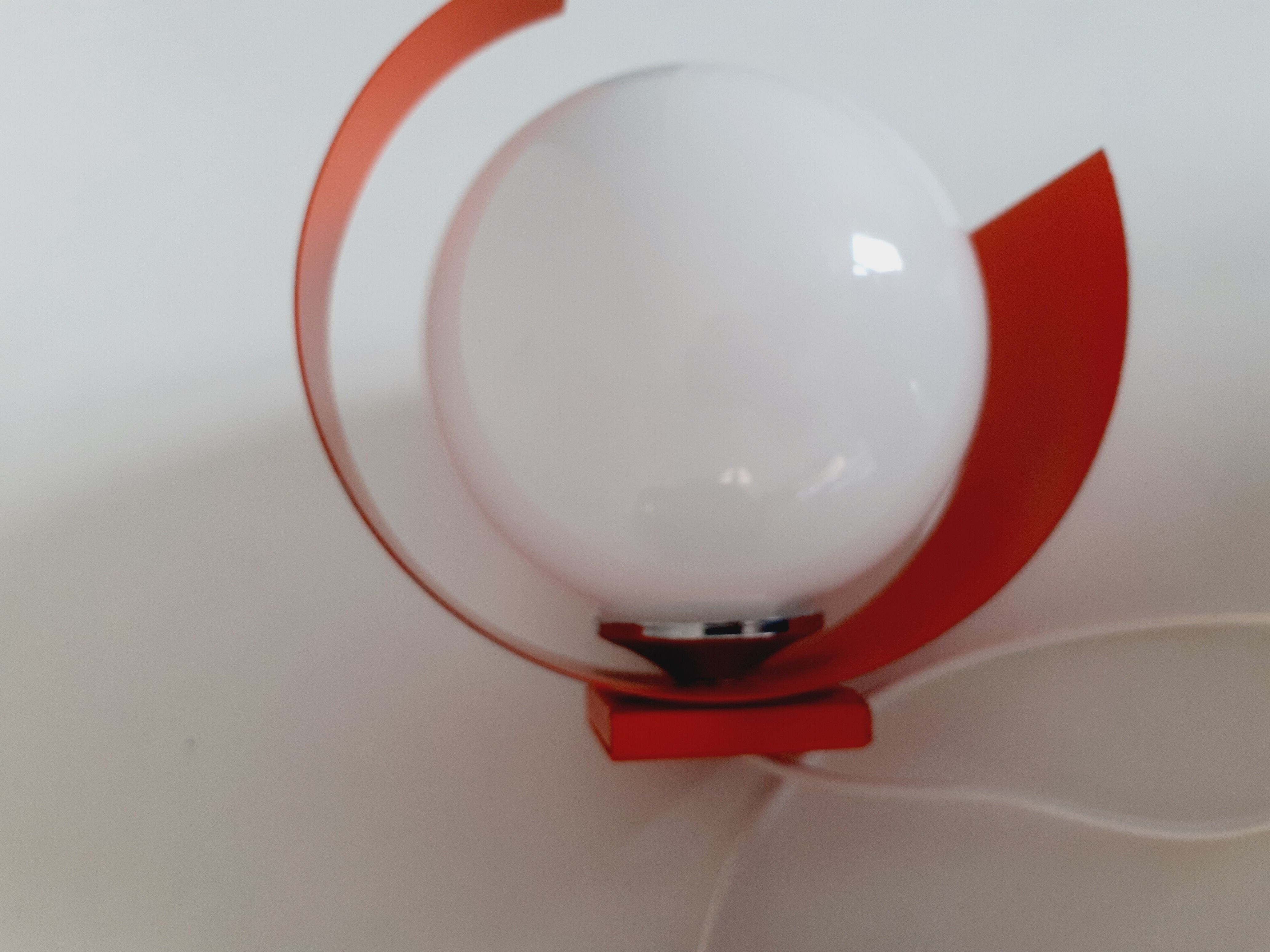 Pair of orange space age wall lamps