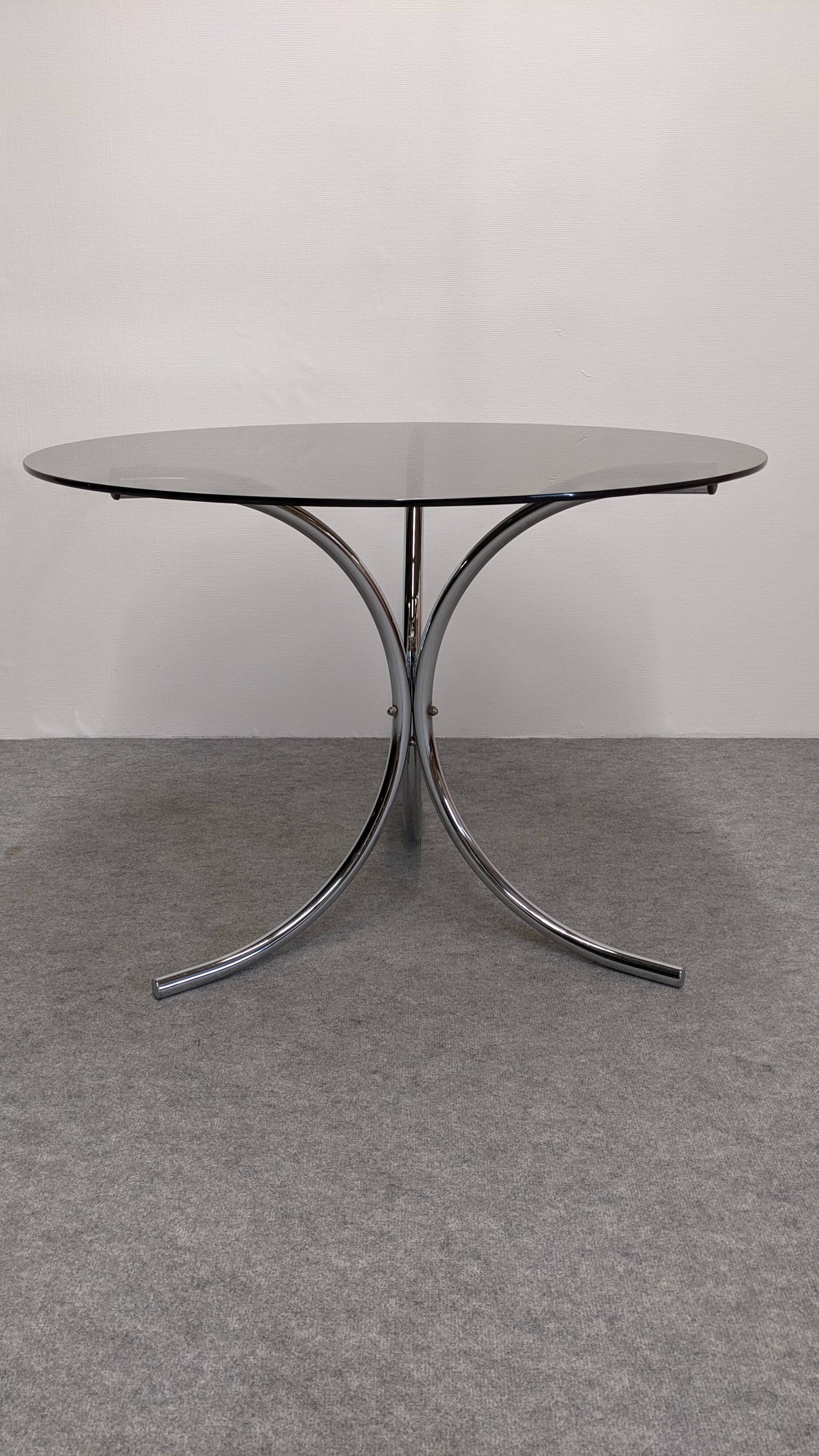 Chrome metal and smoked glass round table, Italy circa 1970.